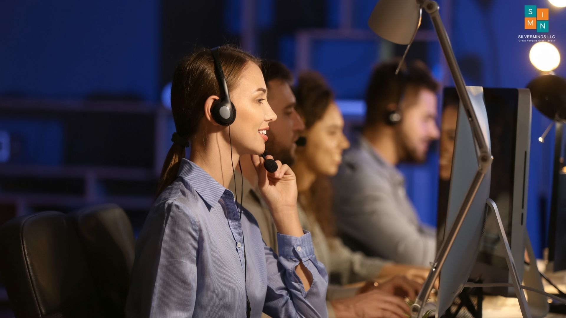 Agents wearing headsets in a contact center